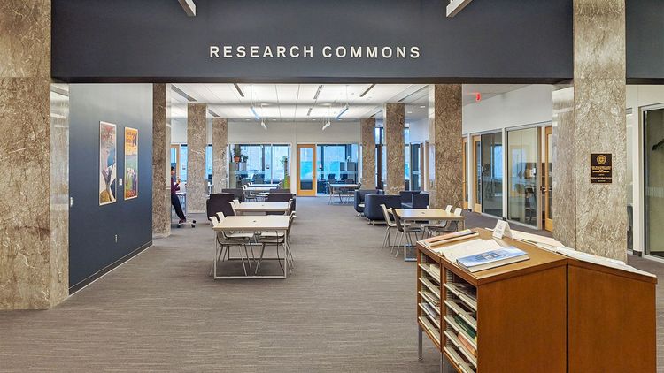 Research Commons is located in the northeast corner, just off the North Entrance, past the staircase. The space includes rows of study tables and comfortable lounge chairs for individual and collaborative work and is surrounded by large windows with tons of natural light.