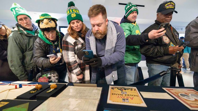 Football fans visit the Shamrock Series exhibit.